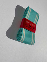 Load image into Gallery viewer, Striped grosgrain premium ribbon roll in a light blue colour with think white stripes on the edges. Add colour and style to your gift wrapping.