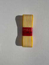 Load image into Gallery viewer, Striped grosgrain premium ribbon roll with white and bright yellow stripes. Add a pop of colour and style to elevate your gift wrapping.