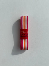 Load image into Gallery viewer, Premium Striped Grosgrain ribbon roll. Stripes include sunset colours - dark pink, light pinks, orange and white stripes. Available in 2.5 metre rolls for stylish gift wrapping.