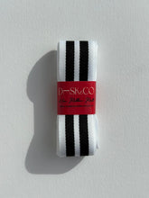 Load image into Gallery viewer, Premium Striped Grosgrain ribbon roll. Stripes include thick black and white stripes. Available in 2.5 metre rolls for stylish gift wrapping.